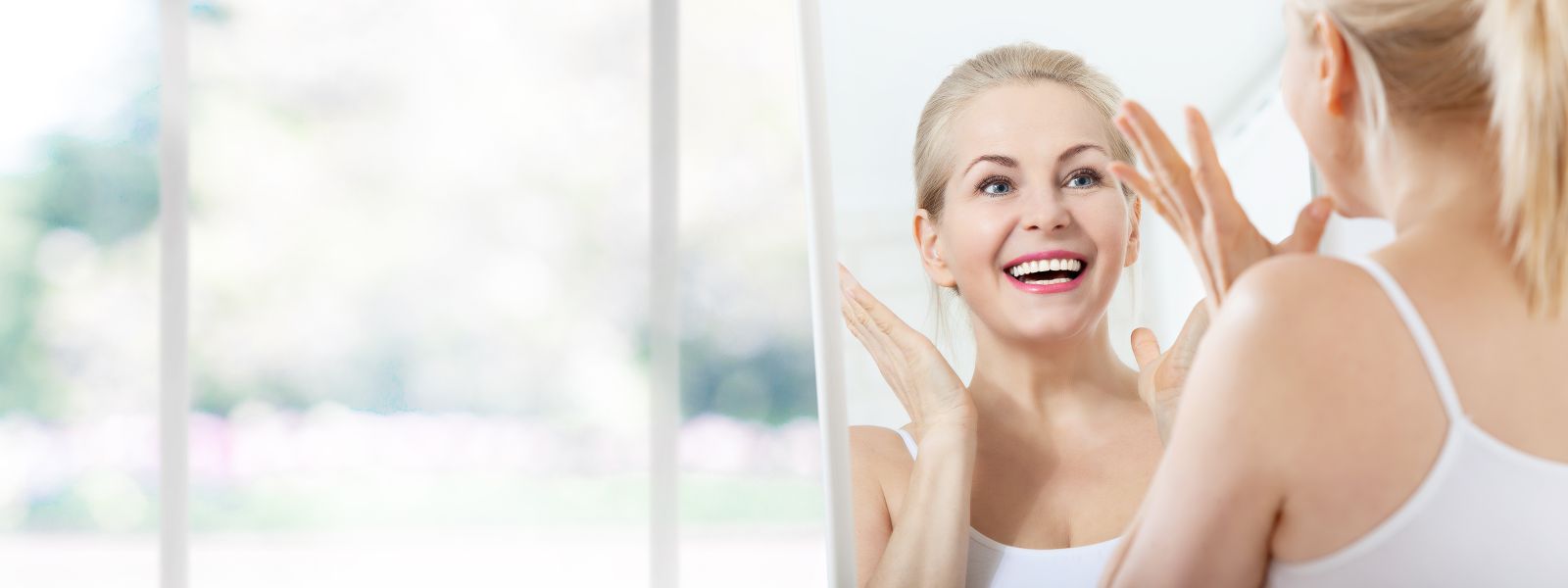 Mature Woman Looking in Mirror