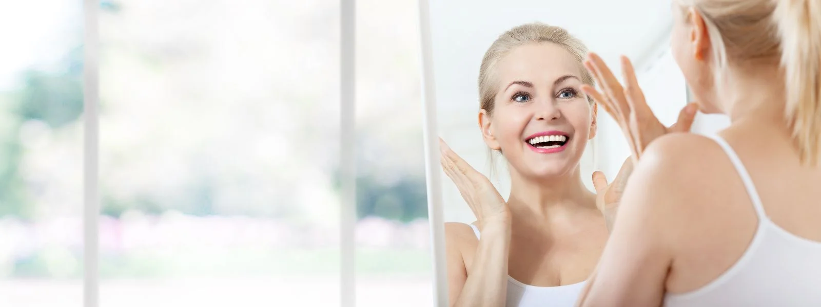 Mature Woman Looking in Mirror